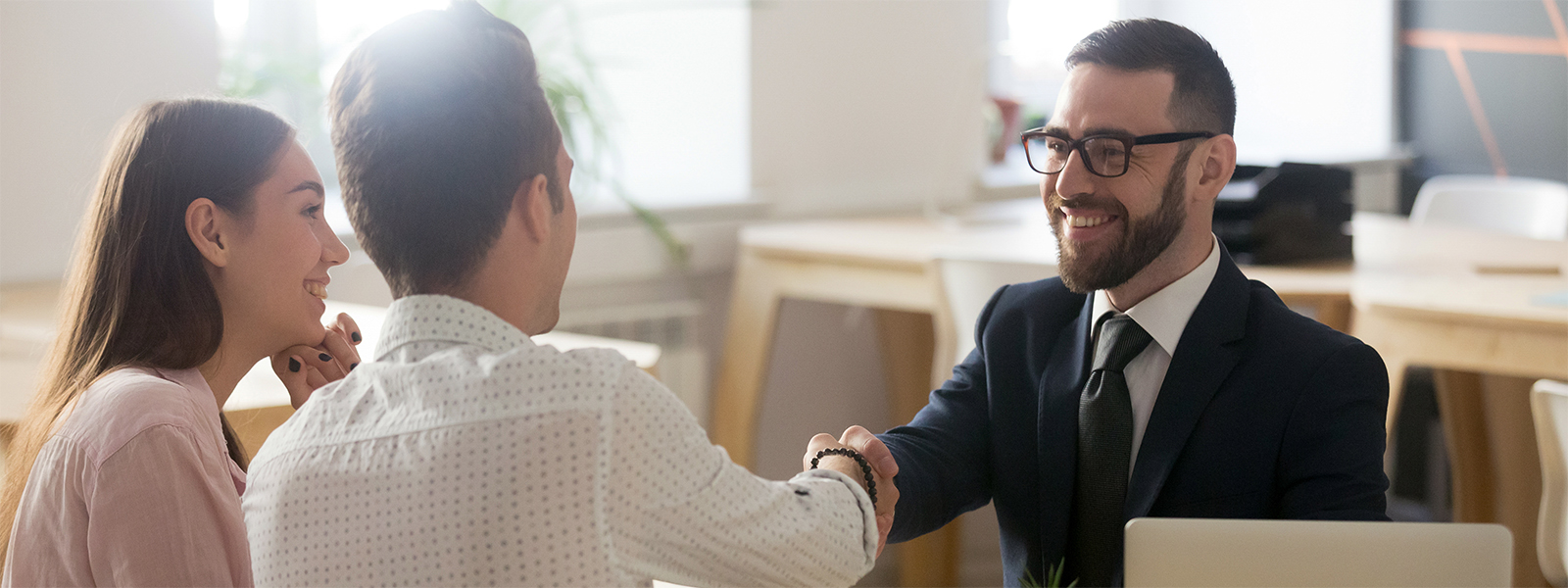 A businesses man making a deal with two clients