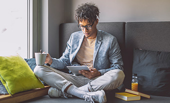 Young man using tablet in living room