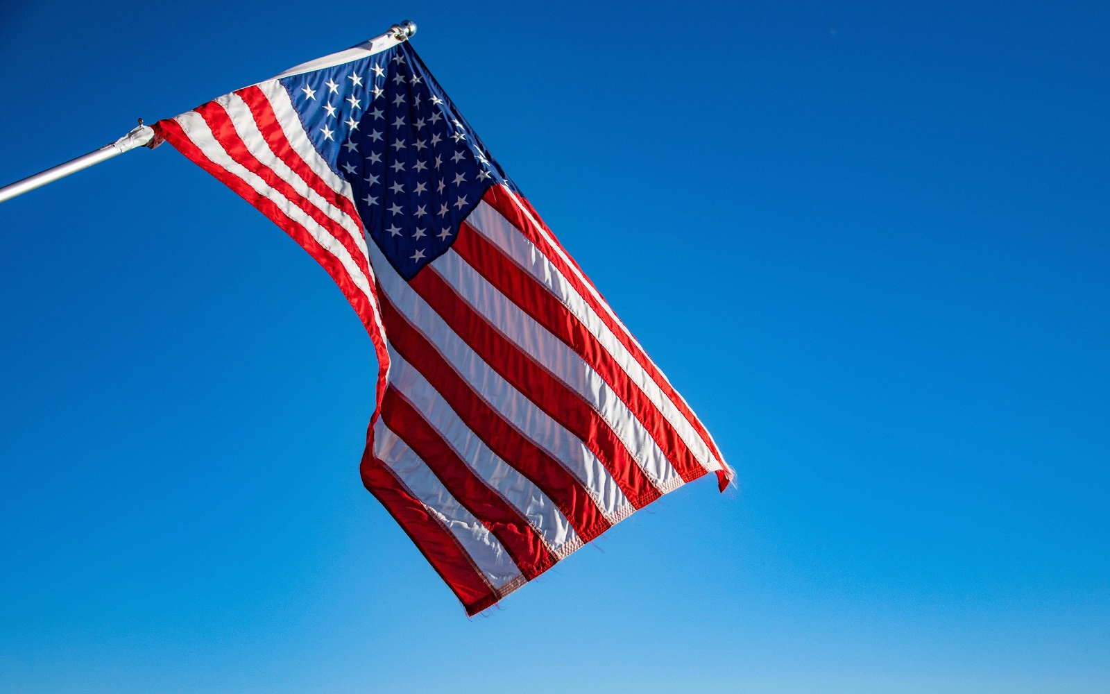 American flag blowing in the wind.