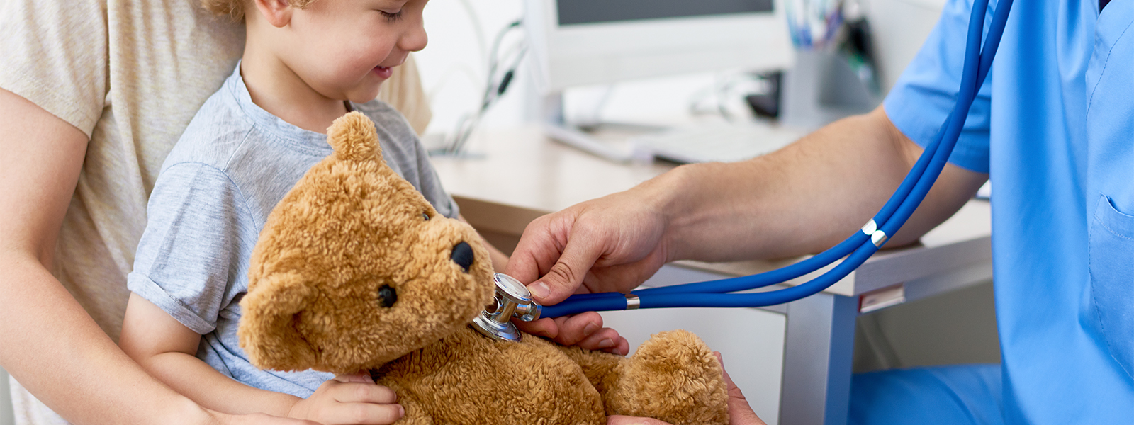 A child brings a teddy bear to the doctor office