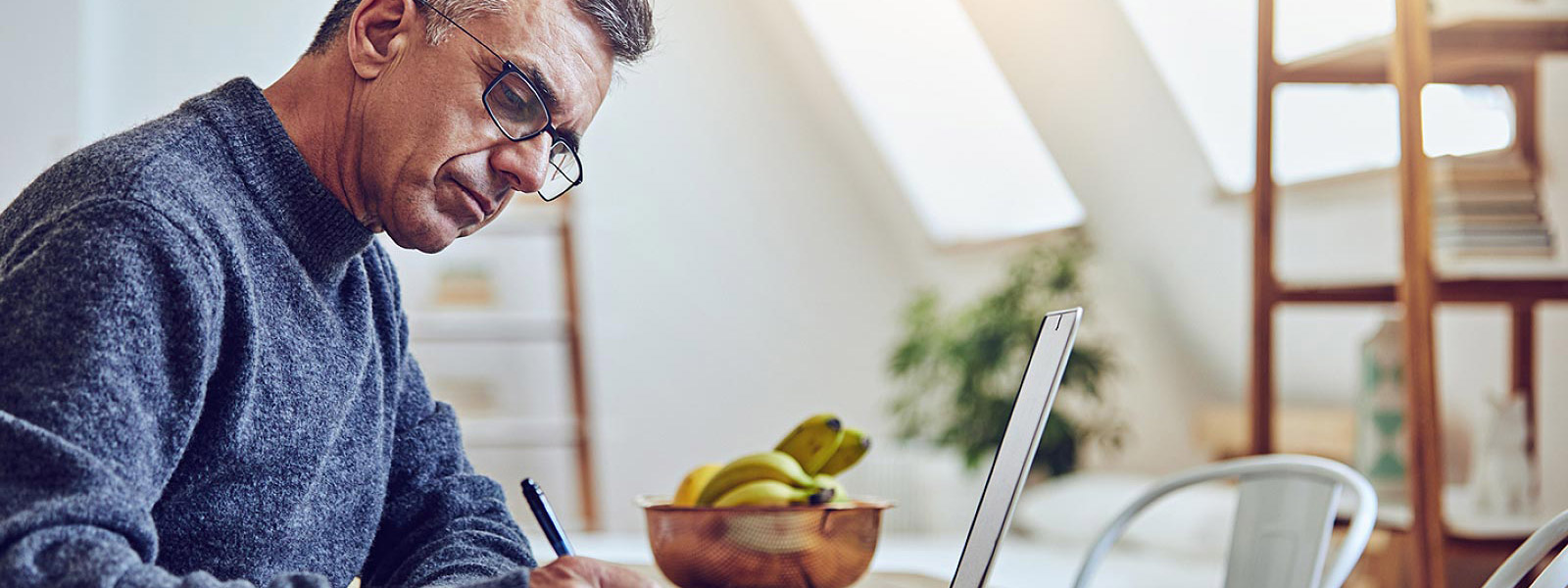 Man using laptop for home business